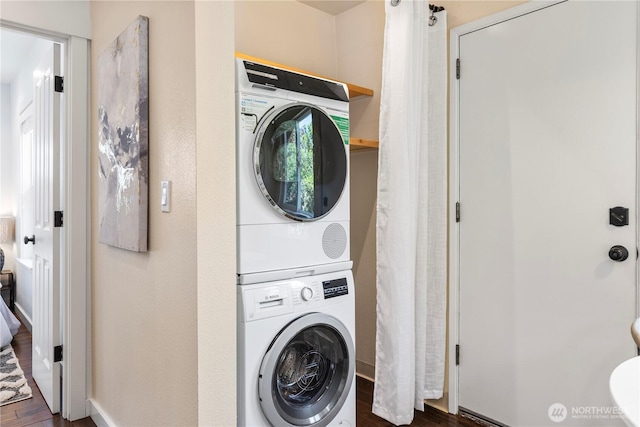 1220 SW Orchard St, Seattle, WA 98106 - washroom with stacked washer / dryer, wood finished floors, and baseboards