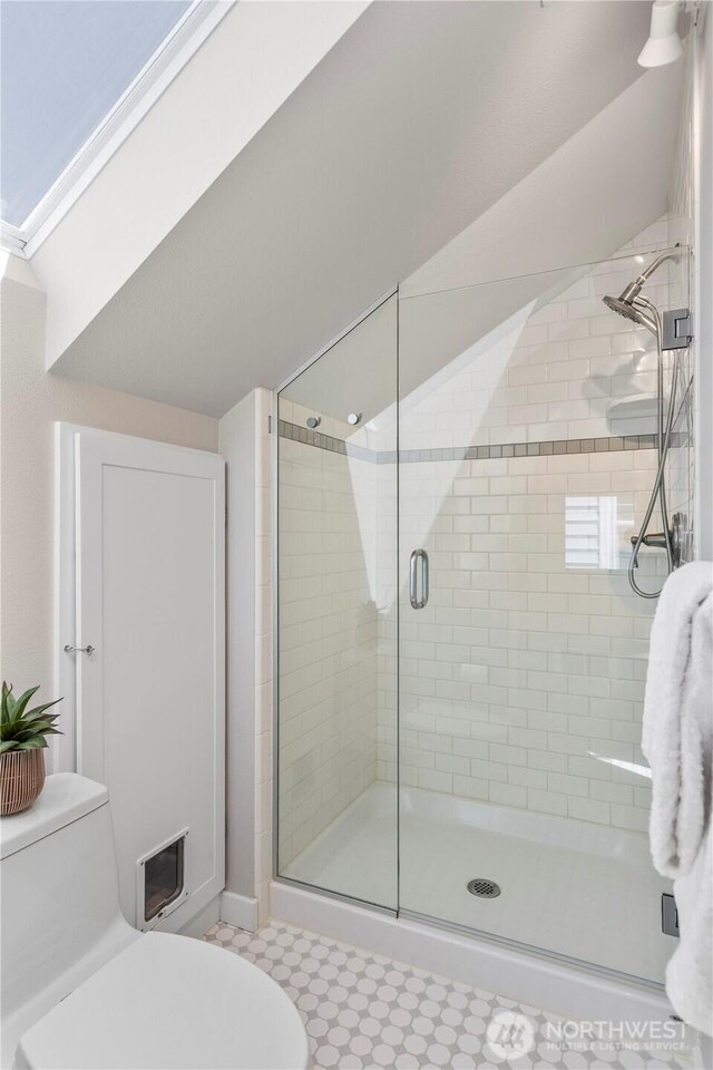 1220 SW Orchard St, Seattle, WA 98106 - full bathroom featuring toilet, a shower stall, and baseboards