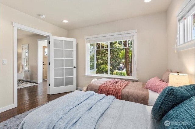 1220 SW Orchard St, Seattle, WA 98106 - bedroom with multiple windows, wood finished floors, baseboards, and recessed lighting