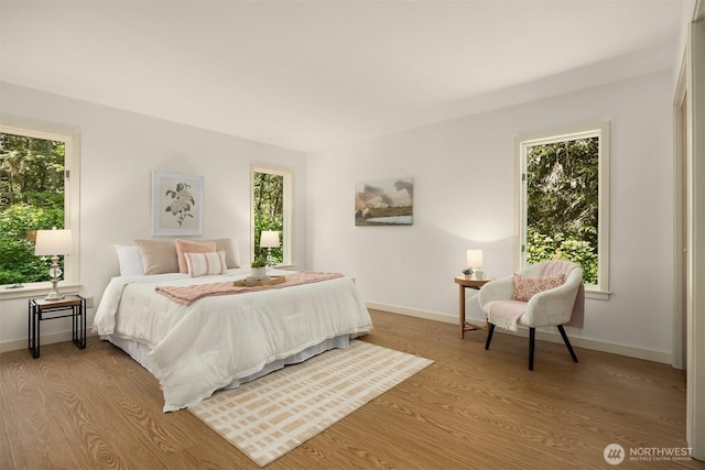 32227 Old Hansville Rd NE, Kingston, WA 98346 - bedroom with multiple windows, light wood-type flooring, and baseboards