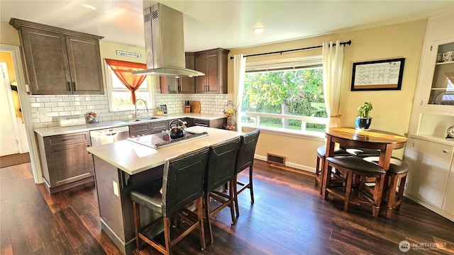 4319 H Street Rd, Blaine, WA 98230 - kitchen with a sink, light countertops, dark wood-style flooring, dishwasher, and backsplash