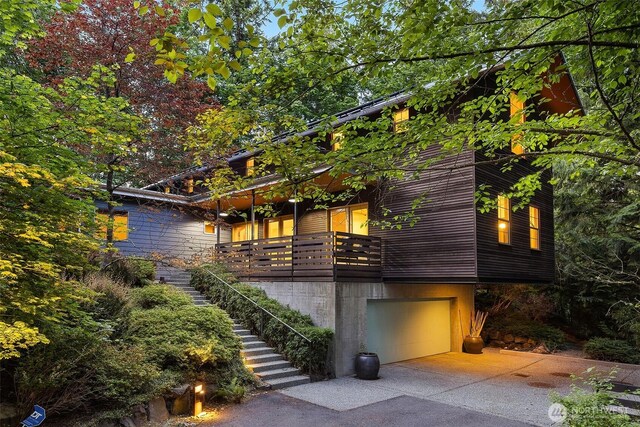 10608 NE 157th St, Bothell, WA 98011 - modern home featuring a garage, stairs, and concrete driveway