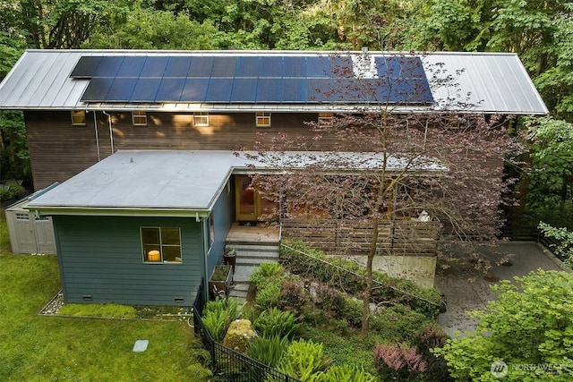 10608 NE 157th St, Bothell, WA 98011 - view of property exterior with a standing seam roof, metal roof, stairway, a lawn, and crawl space
