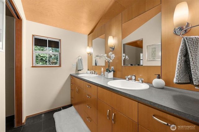 10608 NE 157th St, Bothell, WA 98011 - full bath featuring tile patterned floors, double vanity, lofted ceiling, and baseboards