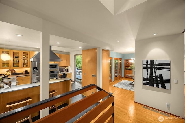 10608 NE 157th St, Bothell, WA 98011 - hall featuring light wood-style flooring and recessed lighting