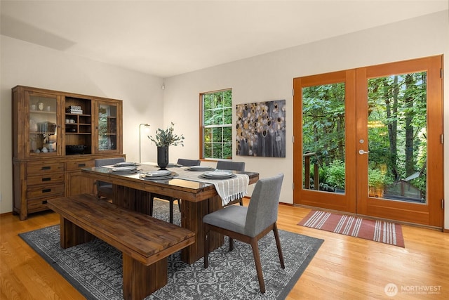 10608 NE 157th St, Bothell, WA 98011 - dining room featuring french doors and light wood finished floors