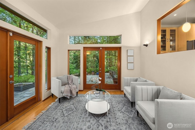 10608 NE 157th St, Bothell, WA 98011 - living area featuring french doors, wood finished floors, and high vaulted ceiling