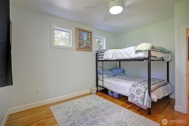 1577 Arrowhead Beach Rd, Camano Island, WA 98282 - bedroom featuring baseboards, wood finished floors, and ceiling fan