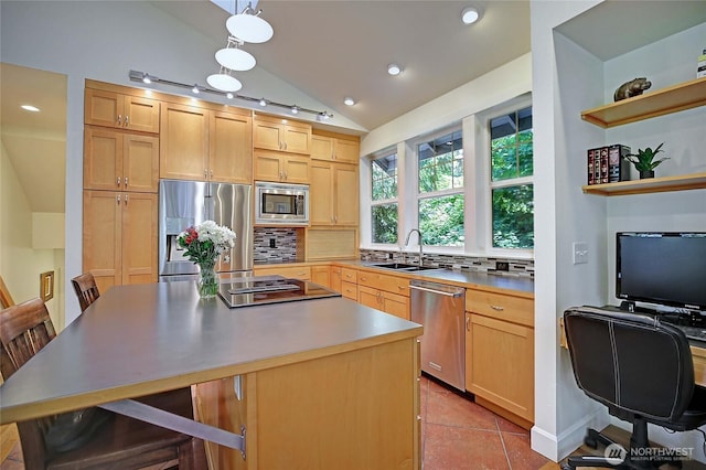 1577 Arrowhead Beach Rd, Camano Island, WA 98282 - kitchen featuring appliances with stainless steel finishes, vaulted ceiling, light brown cabinets, a sink, and backsplash