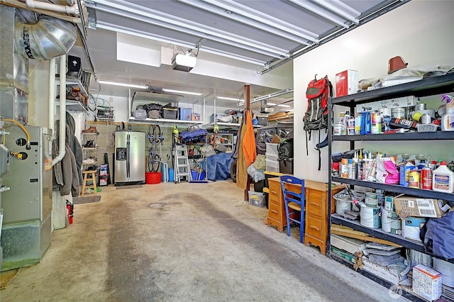 1577 Arrowhead Beach Rd, Camano Island, WA 98282 - garage with water heater and a garage door opener