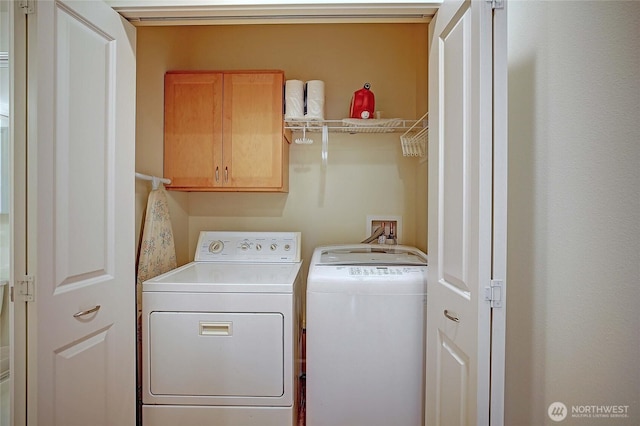 1577 Arrowhead Beach Rd, Camano Island, WA 98282 - laundry room featuring cabinet space and washing machine and clothes dryer