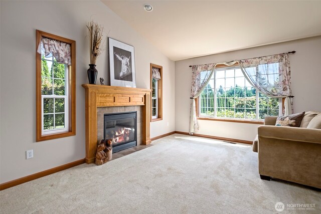 3210 275th St NE, Arlington, WA 98223 - living room with a tile fireplace, carpet, baseboards, and vaulted ceiling