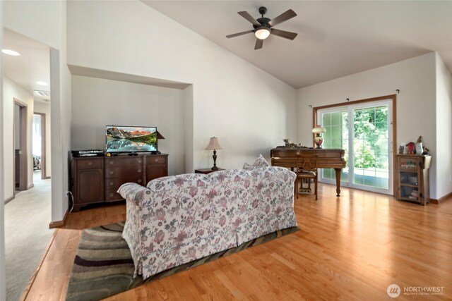 3210 275th St NE, Arlington, WA 98223 - living area with light wood finished floors, ceiling fan, baseboards, and high vaulted ceiling