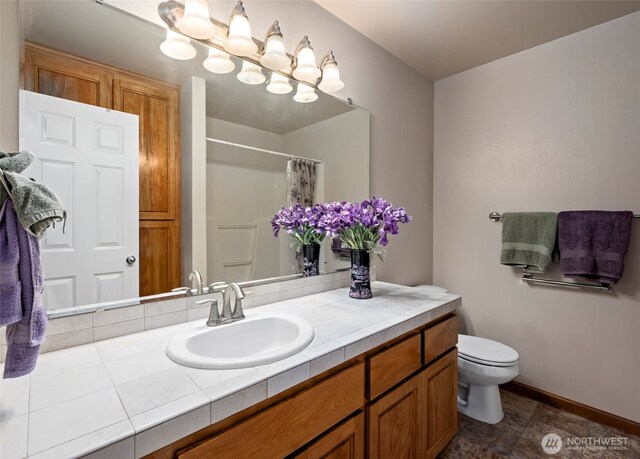 3210 275th St NE, Arlington, WA 98223 - full bathroom featuring vanity, toilet, curtained shower, and baseboards