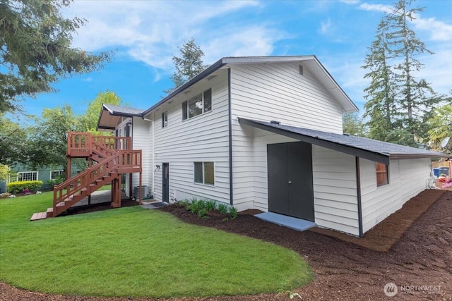 12816 130th Ct NE, Kirkland, WA 98034 - back of property featuring a yard, stairs, and a deck
