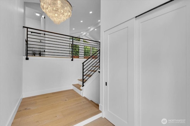 12816 130th Ct NE, Kirkland, WA 98034 - stairs featuring a chandelier, wood finished floors, baseboards, recessed lighting, and lofted ceiling