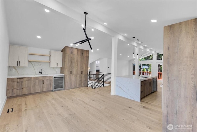12816 130th Ct NE, Kirkland, WA 98034 - kitchen featuring modern cabinets, wine cooler, vaulted ceiling, open shelves, and light wood finished floors