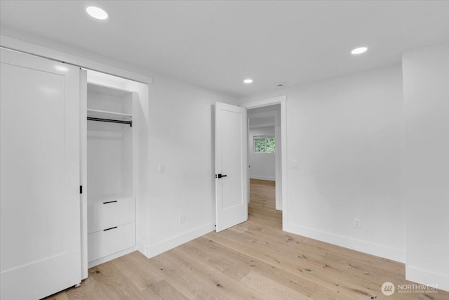 12816 130th Ct NE, Kirkland, WA 98034 - unfurnished bedroom with recessed lighting, light wood-type flooring, and baseboards