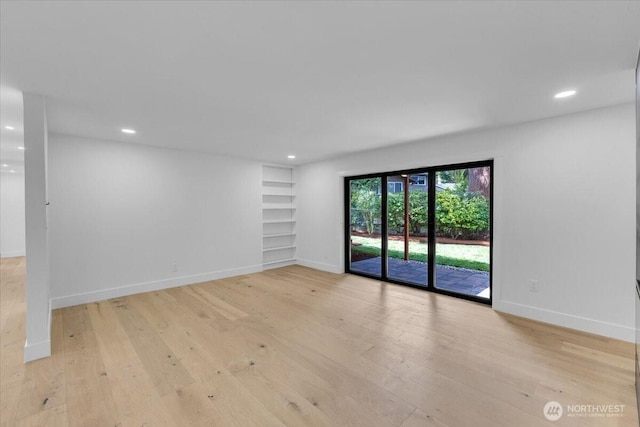 12816 130th Ct NE, Kirkland, WA 98034 - spare room with light wood-style floors, built in features, baseboards, and recessed lighting