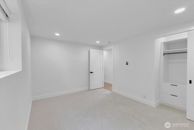 12816 130th Ct NE, Kirkland, WA 98034 - unfurnished bedroom with recessed lighting, light carpet, baseboards, and a closet