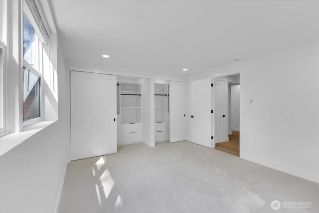 12816 130th Ct NE, Kirkland, WA 98034 - unfurnished bedroom with two closets, carpet floors, recessed lighting, and baseboards