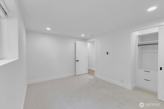 12816 130th Ct NE, Kirkland, WA 98034 - unfurnished bedroom with recessed lighting, light carpet, baseboards, and a closet