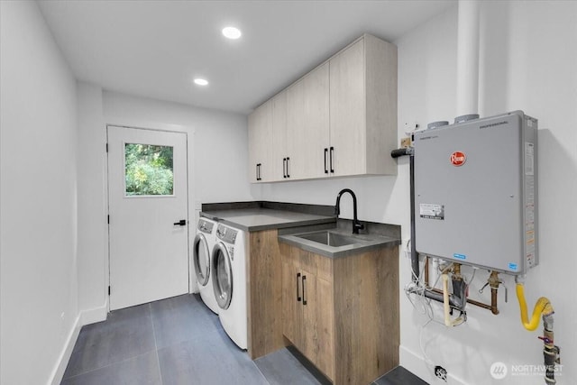 12816 130th Ct NE, Kirkland, WA 98034 - laundry area featuring tankless water heater, cabinet space, separate washer and dryer, recessed lighting, and baseboards