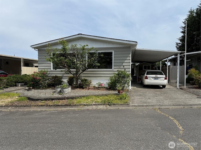 1415 84th St SE Unit 196, Everett, WA 98208 - manufactured / mobile home featuring driveway and a carport