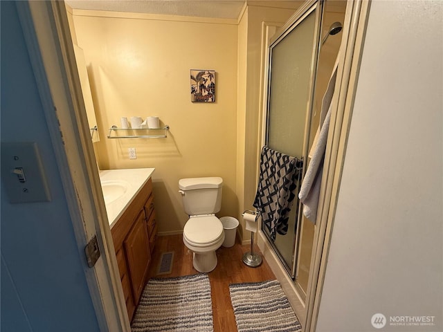 1415 84th St SE Unit 196, Everett, WA 98208 - bathroom featuring wood finished floors, a shower stall, and vanity