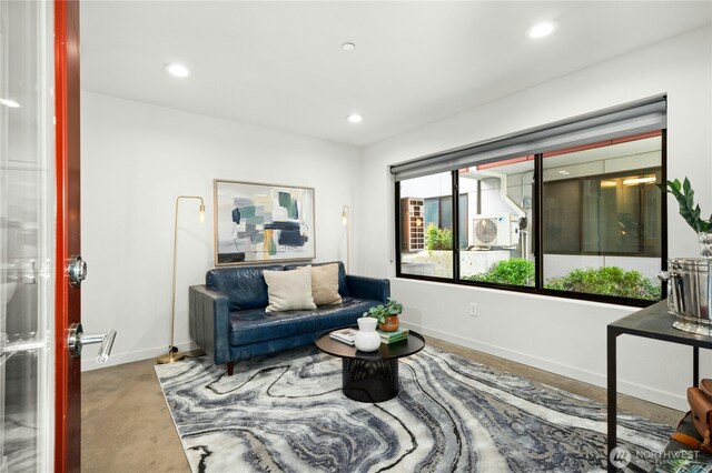 3219 California Ave SW Unit B, Seattle, WA 98116 - living room with baseboards, recessed lighting, and concrete flooring
