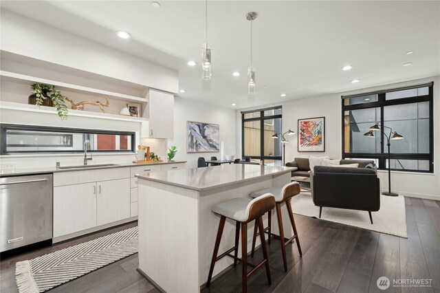 3219 California Ave SW Unit B, Seattle, WA 98116 - kitchen with open shelves, dishwasher, a sink, white cabinetry, and dark wood-style floors