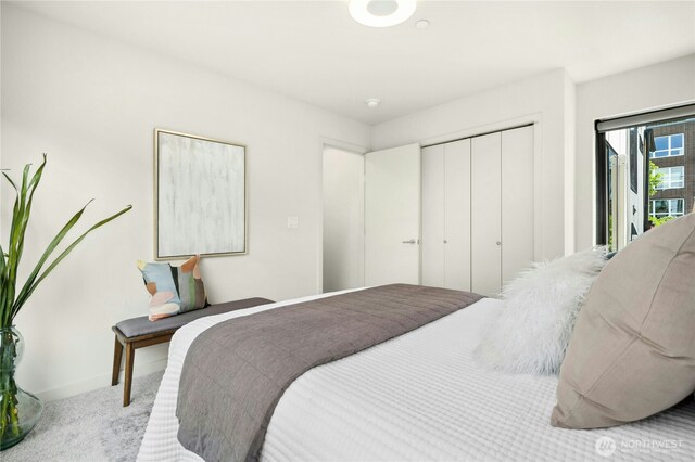 3219 California Ave SW Unit B, Seattle, WA 98116 - bedroom with carpet flooring, a closet, baseboards, and access to exterior