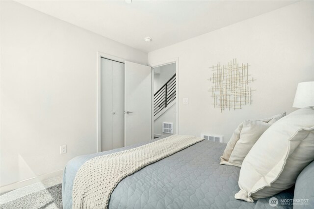 3219 California Ave SW Unit B, Seattle, WA 98116 - carpeted bedroom featuring baseboards and a closet