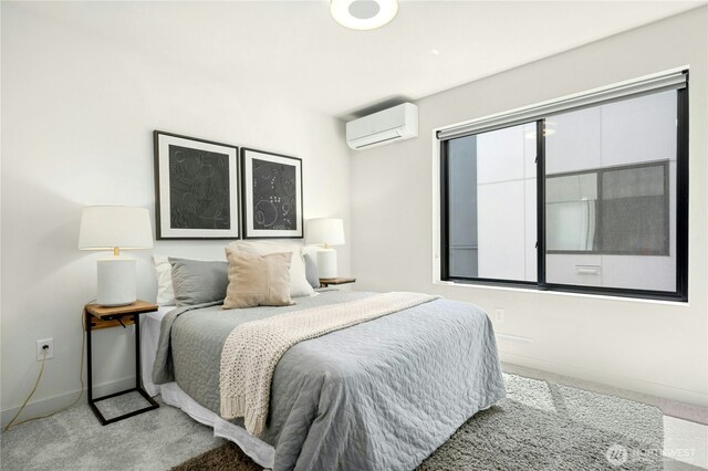 3219 California Ave SW Unit B, Seattle, WA 98116 - carpeted bedroom with a wall unit AC and baseboards