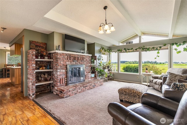 405 E Wiser Lake Rd, Lynden, WA 98264 - living room with a chandelier, a textured ceiling, a brick fireplace, and wood finished floors