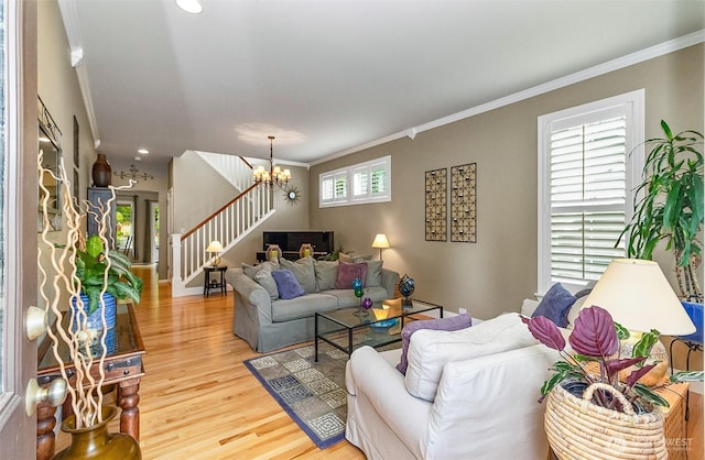 7623 152nd St SE, Snohomish, WA 98296 - living area with ornamental molding, light wood-type flooring, a chandelier, and stairway