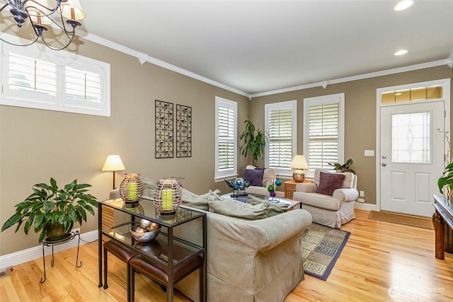 7623 152nd St SE, Snohomish, WA 98296 - living room with crown molding, light wood-style flooring, a chandelier, baseboards, and recessed lighting