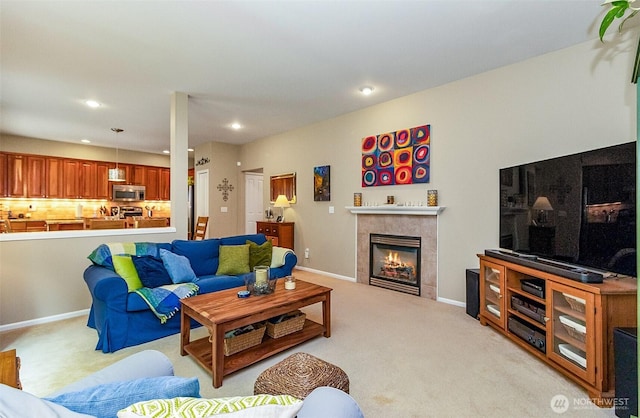 7623 152nd St SE, Snohomish, WA 98296 - living area with light colored carpet, a tiled fireplace, recessed lighting, and baseboards