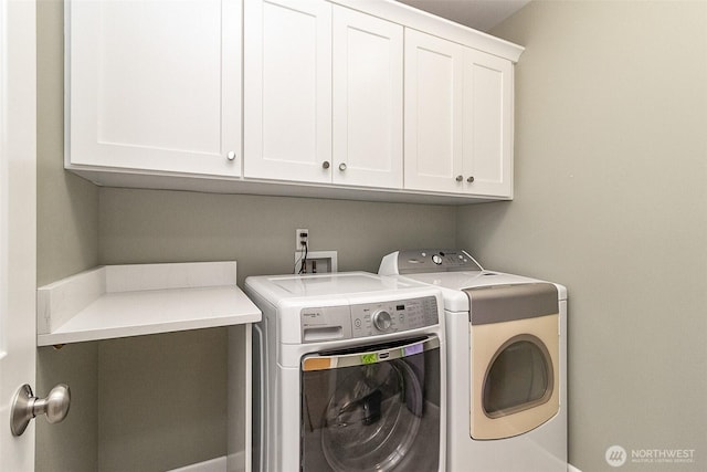 7623 152nd St SE, Snohomish, WA 98296 - laundry area with cabinet space and washer and clothes dryer