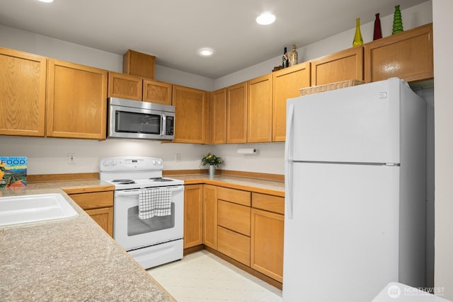 8828 238th St SW Unit D-1, Edmonds, WA 98026 - kitchen featuring white appliances, light countertops, light flooring, and recessed lighting