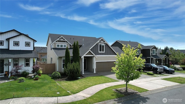 10027 SE Dotson St SE, Yelm, WA 98597 - view of front of house with board and batten siding, driveway, a residential view, and roof with shingles