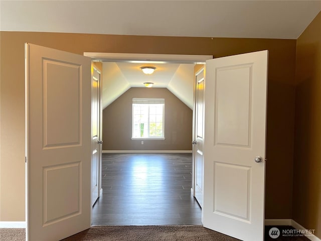 10027 SE Dotson St SE, Yelm, WA 98597 - bonus room featuring vaulted ceiling, dark wood-style floors, and baseboards