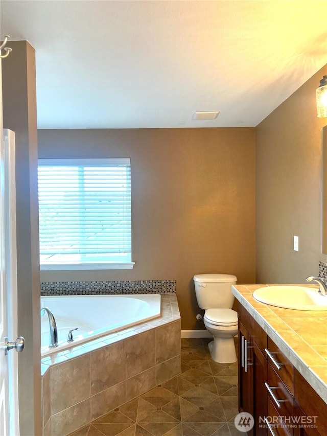 10027 SE Dotson St SE, Yelm, WA 98597 - full bathroom featuring a bath, double vanity, toilet, and tile patterned flooring