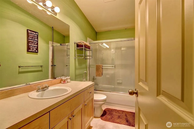536ST N 103rd Unit A, Seattle, WA 98133 - full bathroom with toilet, vanity, tile patterned floors, and combined bath / shower with glass door