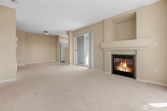 4343 Roosevelt Way NE Unit 401, Seattle, WA 98105 - unfurnished living room featuring a glass covered fireplace and carpet flooring