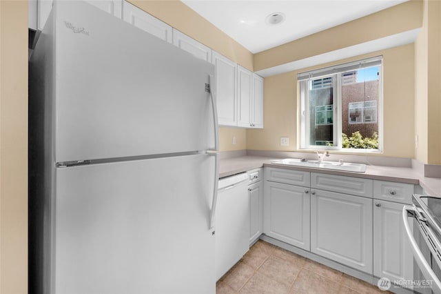 4343 Roosevelt Way NE Unit 401, Seattle, WA 98105 - kitchen featuring white appliances, white cabinets, light countertops, and light tile patterned flooring