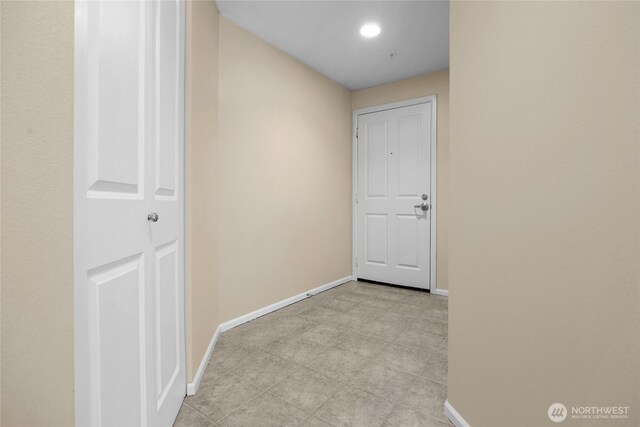4343 Roosevelt Way NE Unit 401, Seattle, WA 98105 - hallway with baseboards and recessed lighting