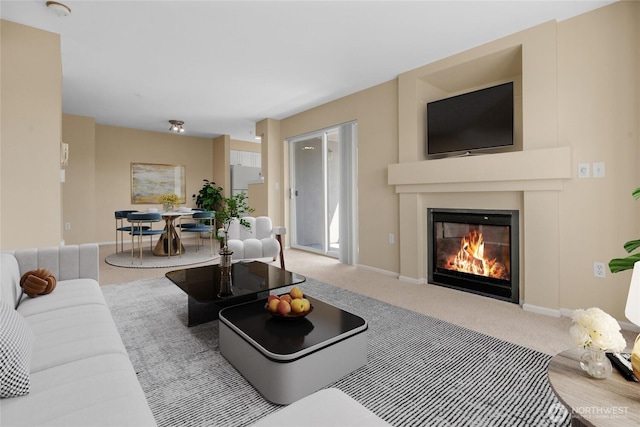4343 Roosevelt Way NE Unit 401, Seattle, WA 98105 - living area with a glass covered fireplace and carpet floors