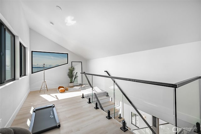 4489 Sucia Dr, Ferndale, WA 98248 - stairs with lofted ceiling, wood finished floors, and baseboards