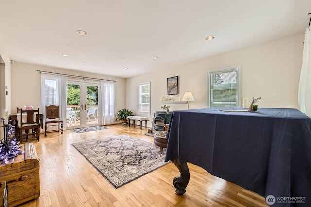 12019B 25th Ave NE, Seattle, WA 98125 - living area with light wood-style flooring, french doors, and recessed lighting